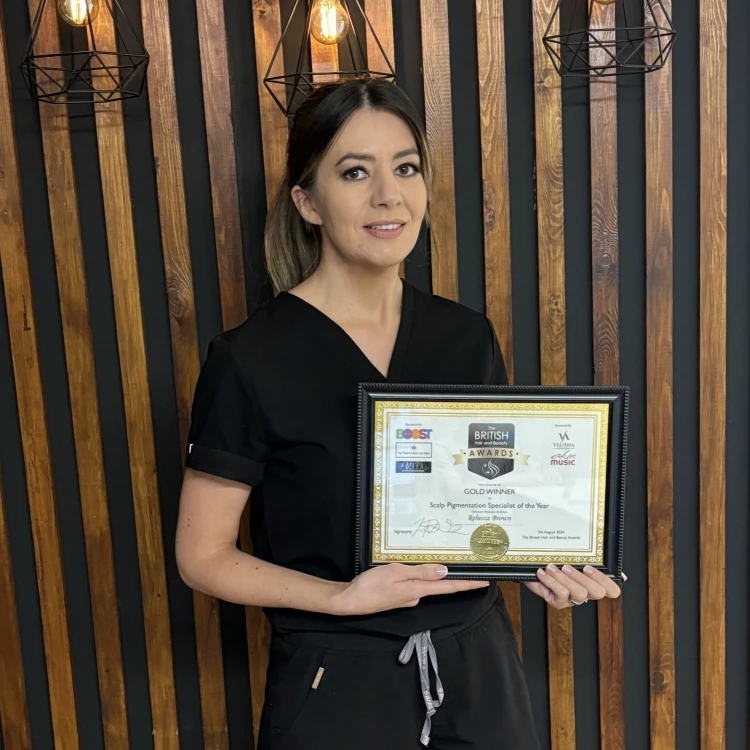 Rebecca Brown holding her BHBA Specialist of the Year 2024 award certificate